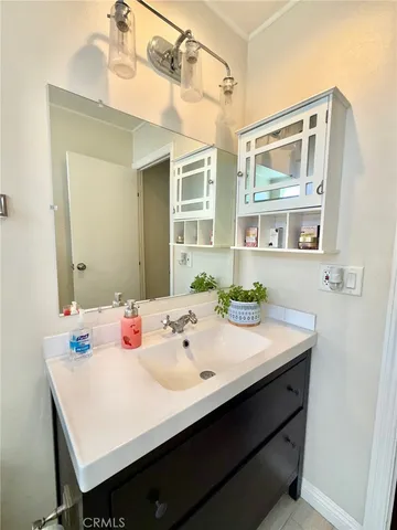 a bathroom with a sink and a window