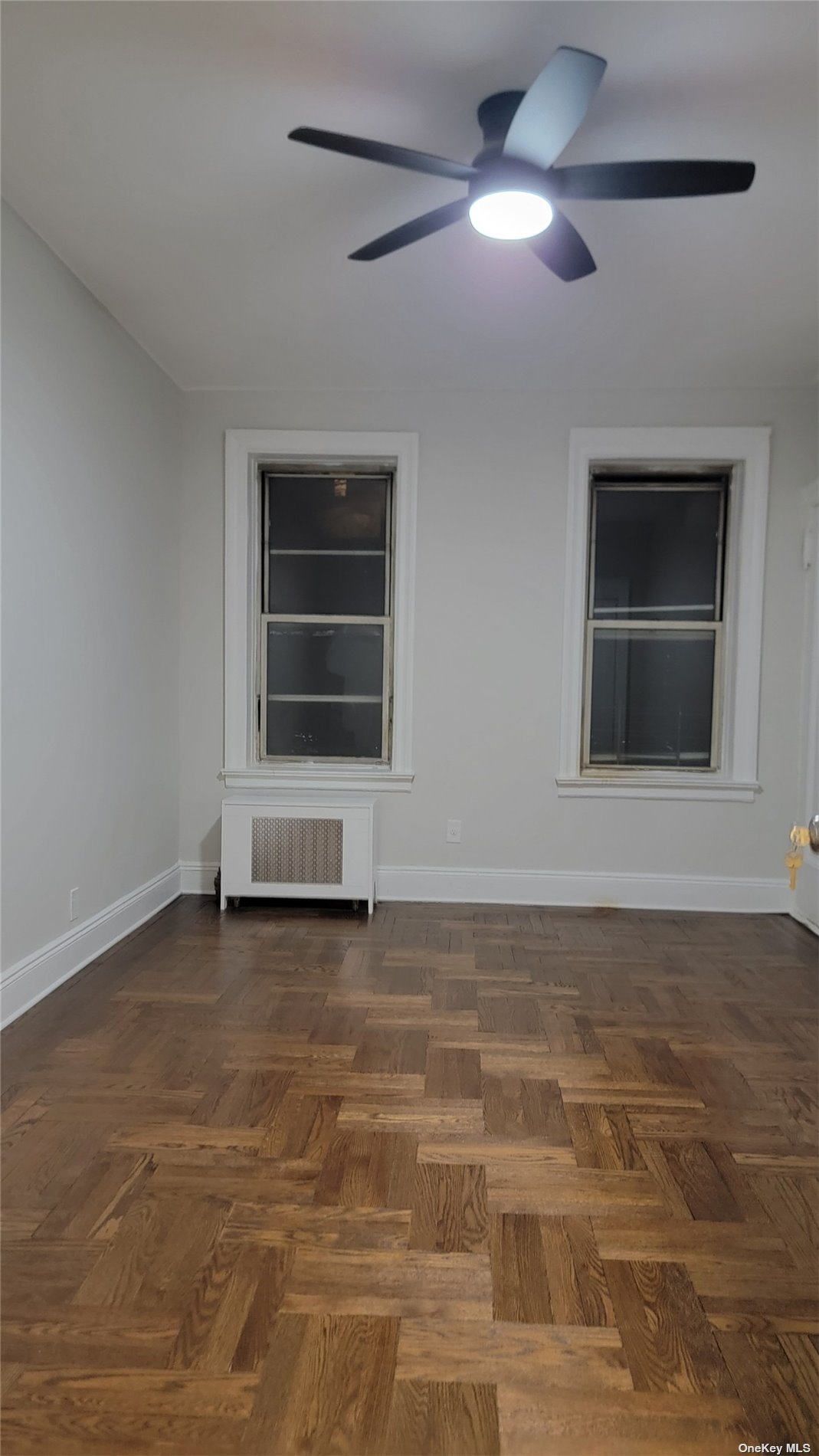 a view of empty room with a fireplace