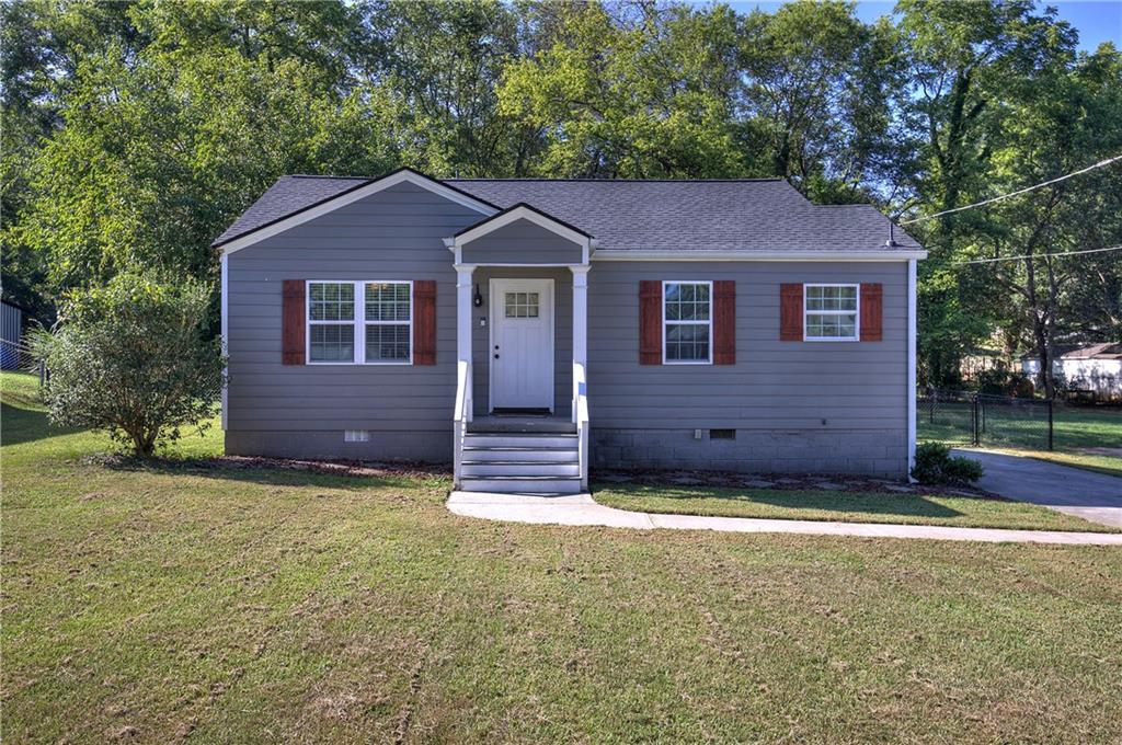 112 Hawthorne Street Southeast Rome, GA 30161 - Photo 1 of 1 a view of a house with a yard