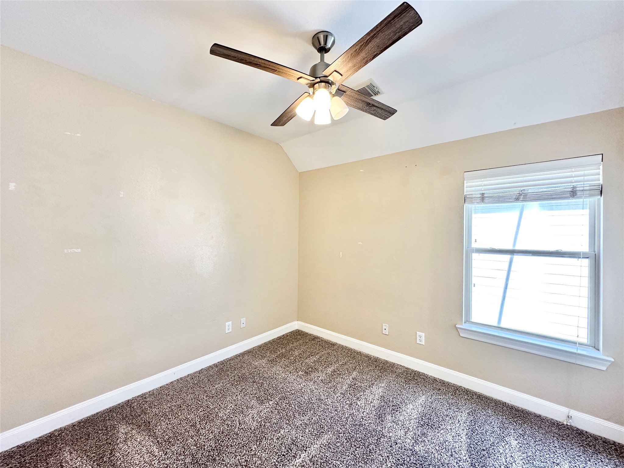 43 Panterra Way Spring, TX 77382 - Photo 14 of 17 an empty room with a window and a fan