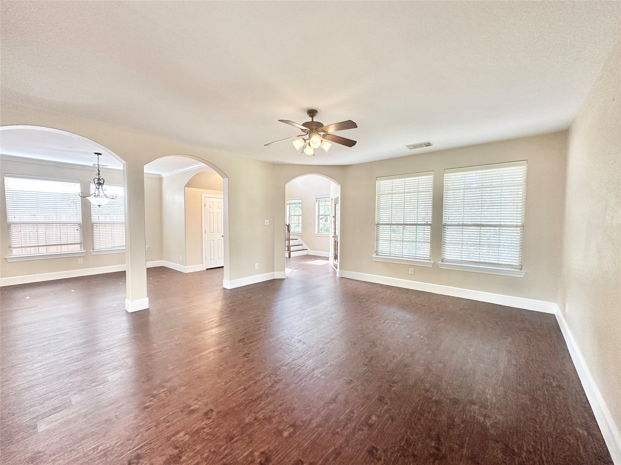 43 Panterra Way Spring, TX 77382 - Photo 6 of 17 a view of an empty room with wooden floor and a window