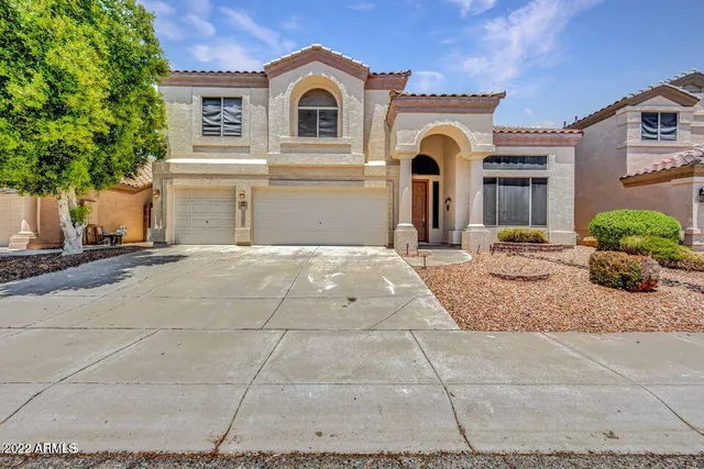 a front view of a house with yard