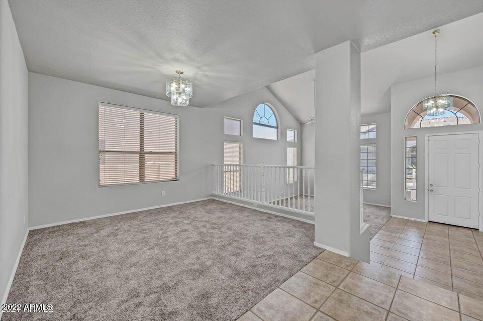 6410 West Hackamore Drive Phoenix, AZ 85083 - Photo 12 of 50 an empty room with fan and windows