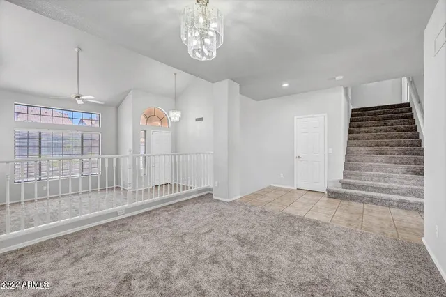 an empty room with a chandelier