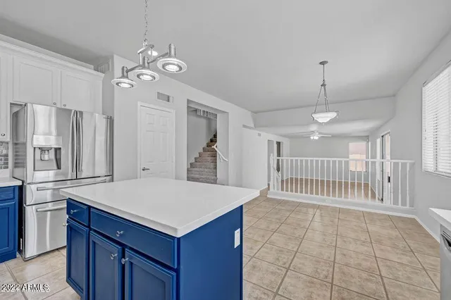 a kitchen with a stove a sink a refrigerator and a oven