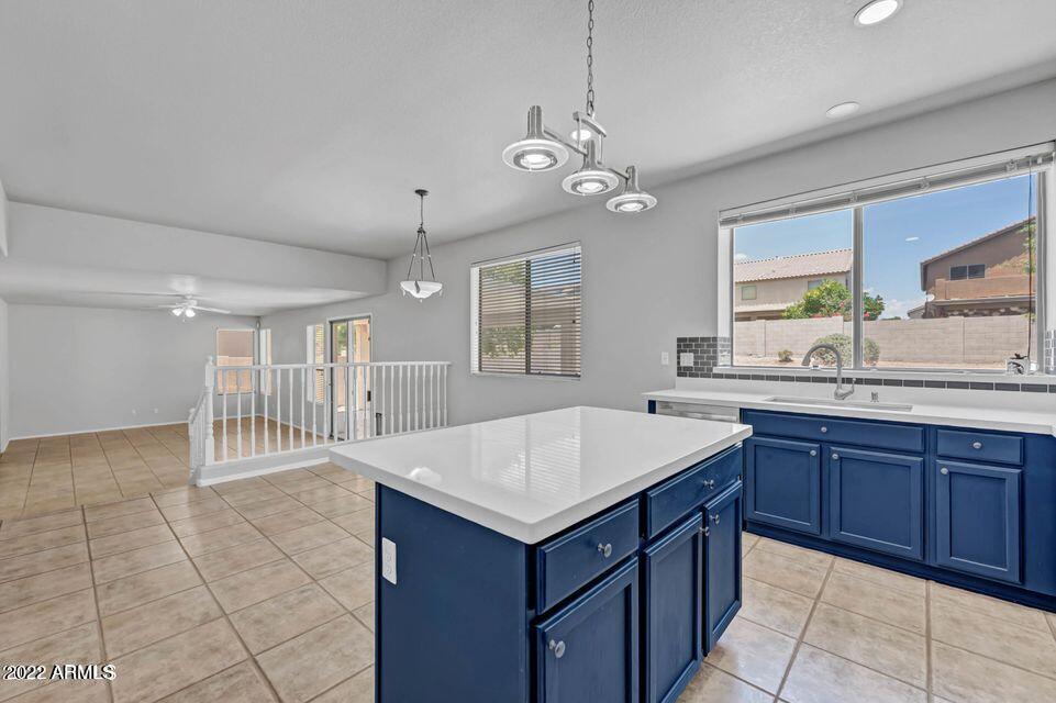 6410 West Hackamore Drive Phoenix, AZ 85083 - Photo 19 of 50 a kitchen with a stove a sink a refrigerator and a oven