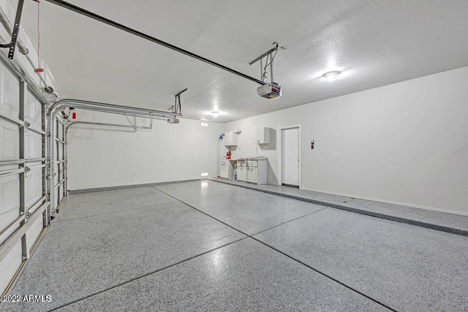6410 West Hackamore Drive Phoenix, AZ 85083 - Photo 32 of 50 a view of empty room with wooden floor and windows