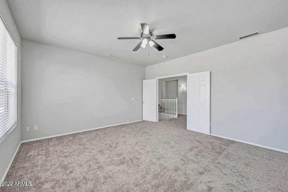 6410 West Hackamore Drive Phoenix, AZ 85083 - Photo 35 of 50 a view of empty room with ceiling fan