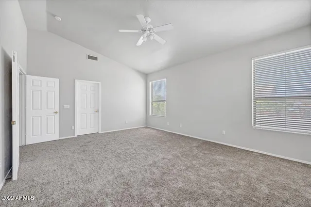 a spacious bathroom with a sink double vanity and a mirror
