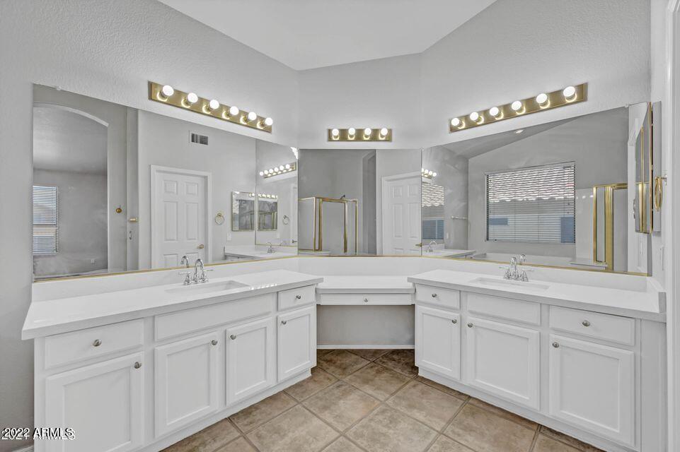 6410 West Hackamore Drive Phoenix, AZ 85083 - Photo 47 of 50 a spacious bathroom with a sink double vanity and a mirror