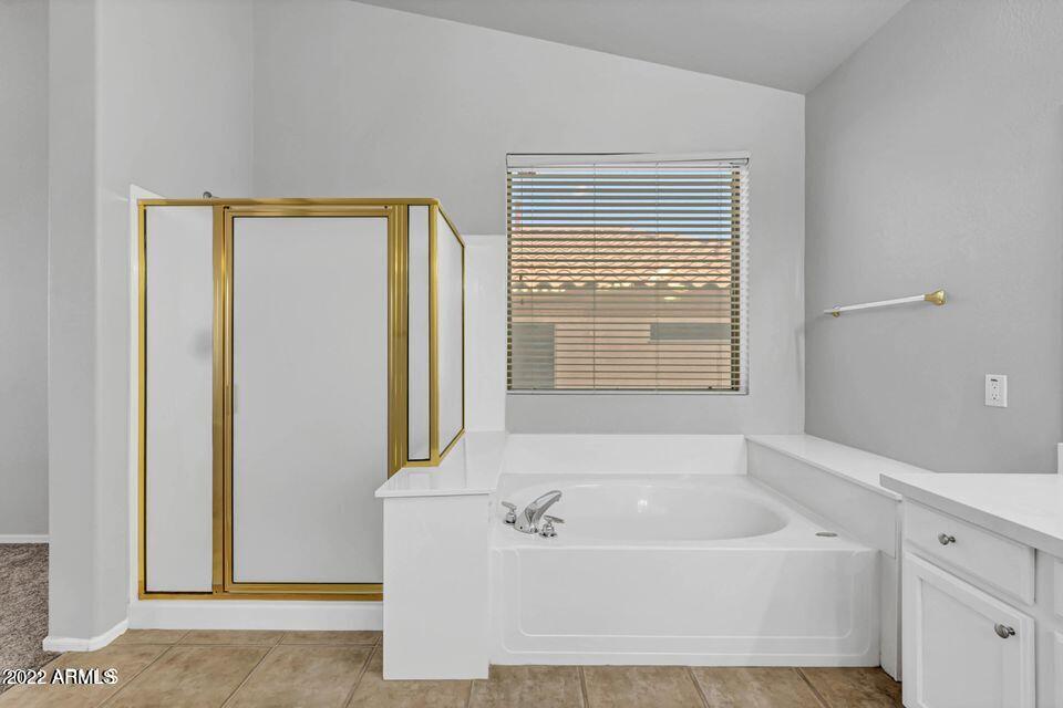 6410 West Hackamore Drive Phoenix, AZ 85083 - Photo 48 of 50 a white bath tub sitting next to a window