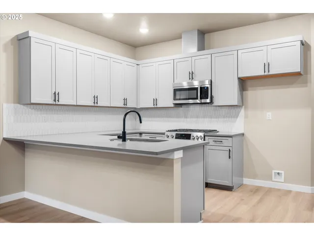 a bathroom with a sink and mirror