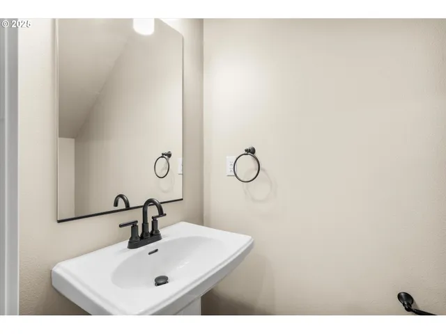 a kitchen with stainless steel appliances granite countertop a sink a microwave and cabinets