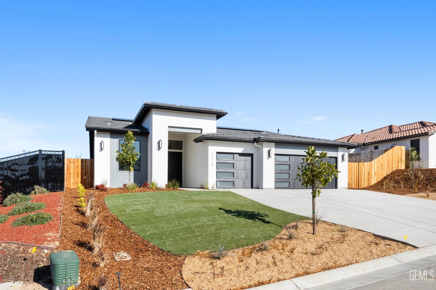 Undisclosed Address Bakersfield, CA 93314 - Photo 1 of 36 a front view of a house with garden