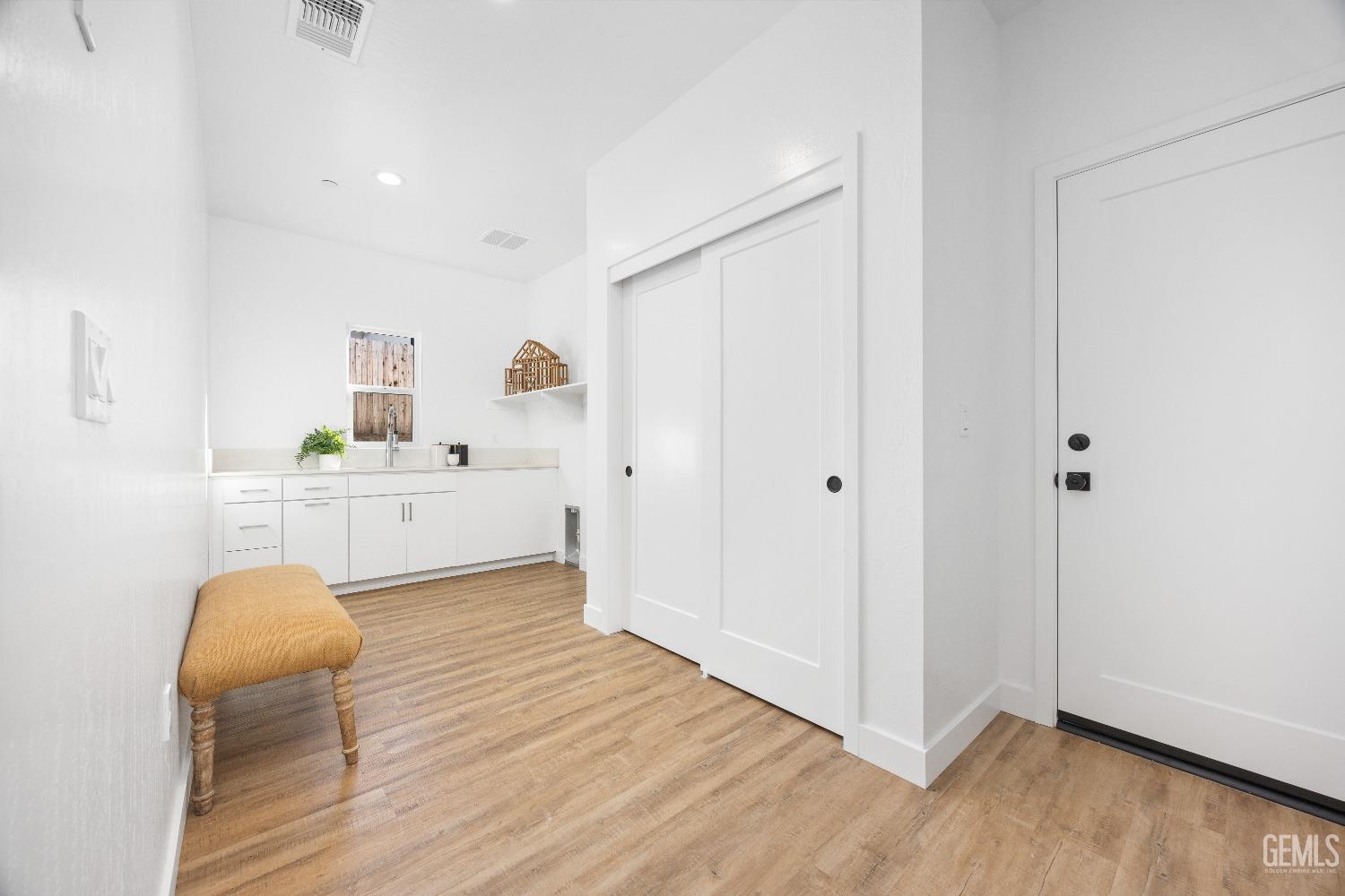 Undisclosed Address Bakersfield, CA 93314 - Photo 12 of 36 a view of a kitchen with wooden floor