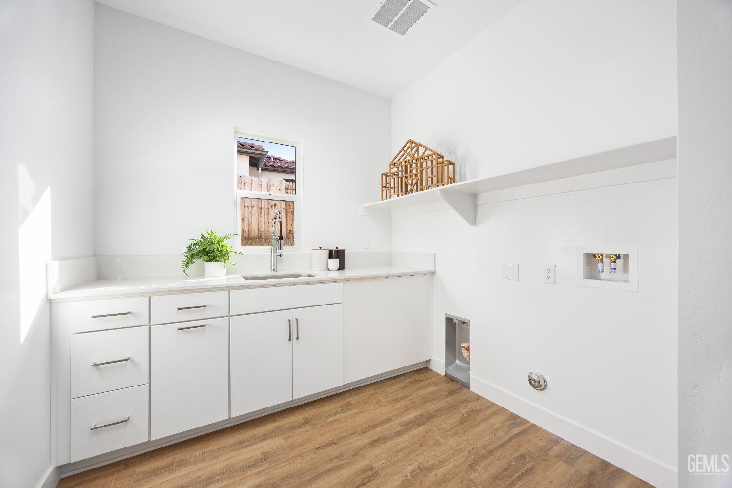 Undisclosed Address Bakersfield, CA 93314 - Photo 13 of 36 a bathroom with a sink and a mirror
