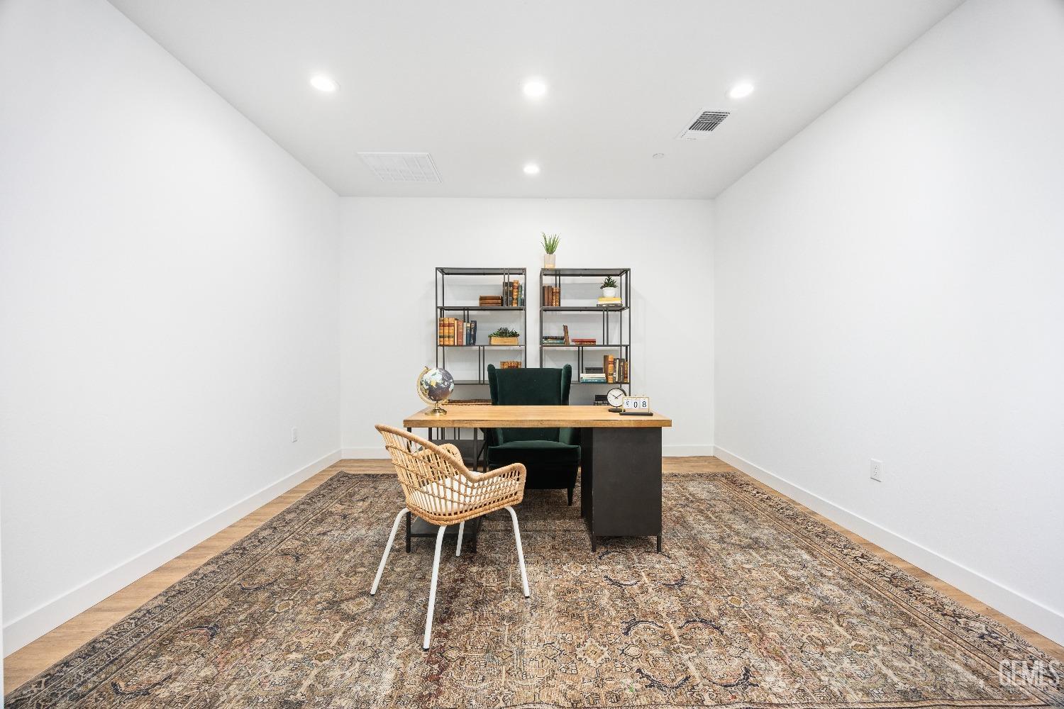 Undisclosed Address Bakersfield, CA 93314 - Photo 16 of 36 a dining room with a wooden table and chairs