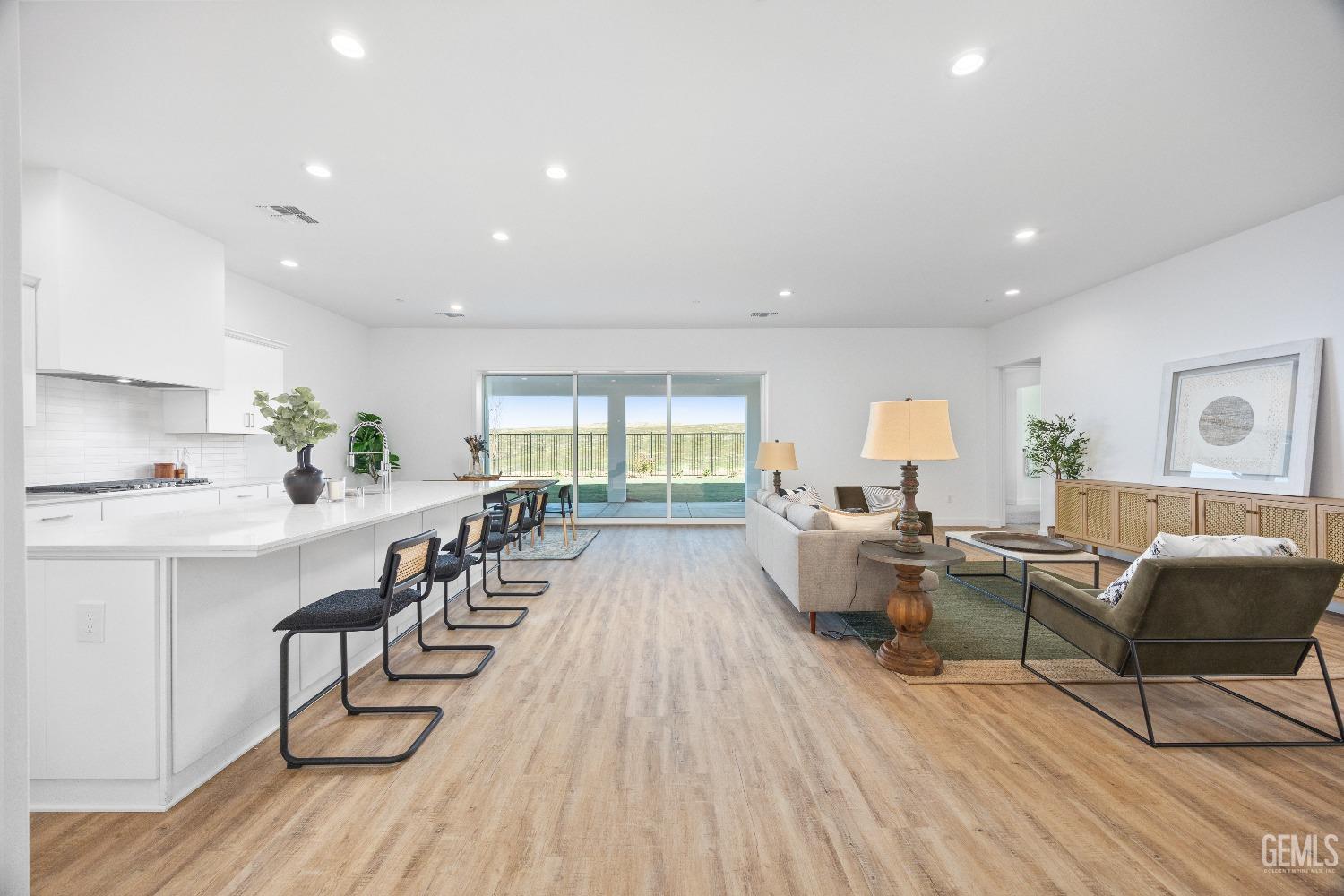 Undisclosed Address Bakersfield, CA 93314 - Photo 20 of 36 a living room with furniture and a wooden floor