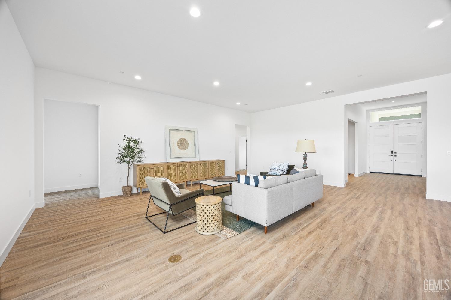 Undisclosed Address Bakersfield, CA 93314 - Photo 21 of 36 a living room with furniture and a wooden floor