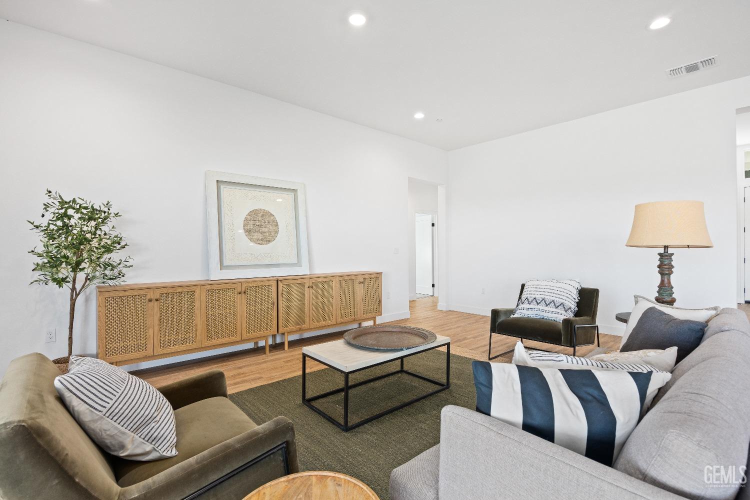 Undisclosed Address Bakersfield, CA 93314 - Photo 22 of 36 a living room with furniture and a couch