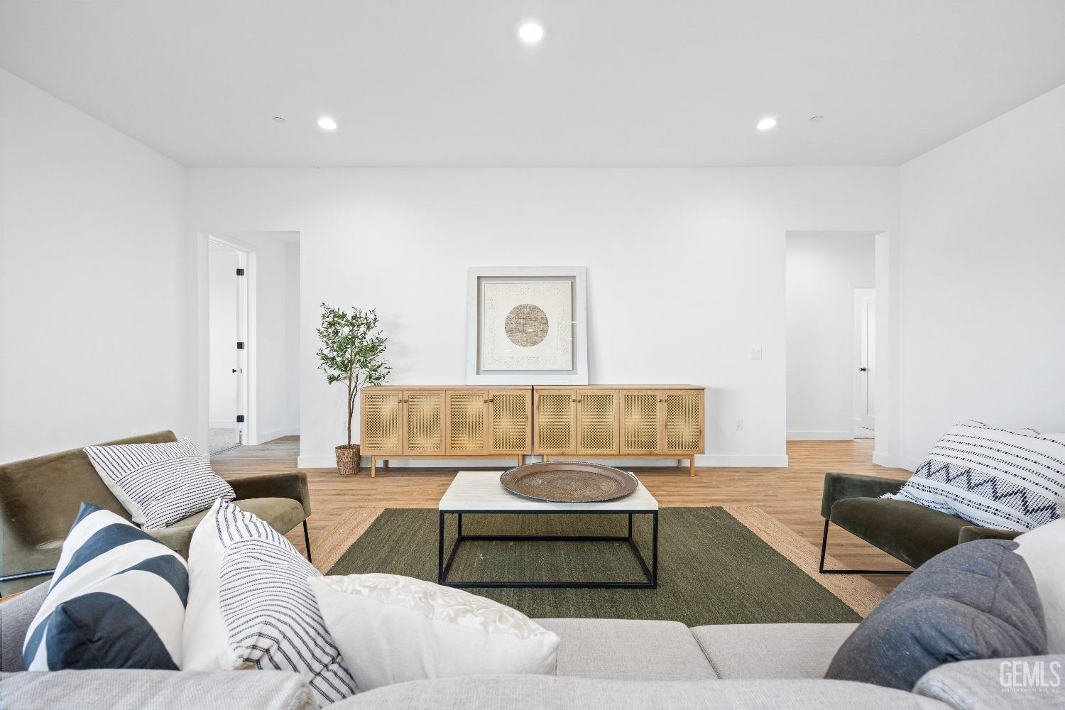 Undisclosed Address Bakersfield, CA 93314 - Photo 23 of 36 a living room with furniture and a couch