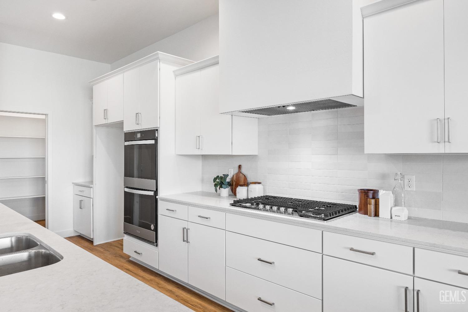Undisclosed Address Bakersfield, CA 93314 - Photo 27 of 36 a kitchen with stainless steel appliances a refrigerator sink and cabinets