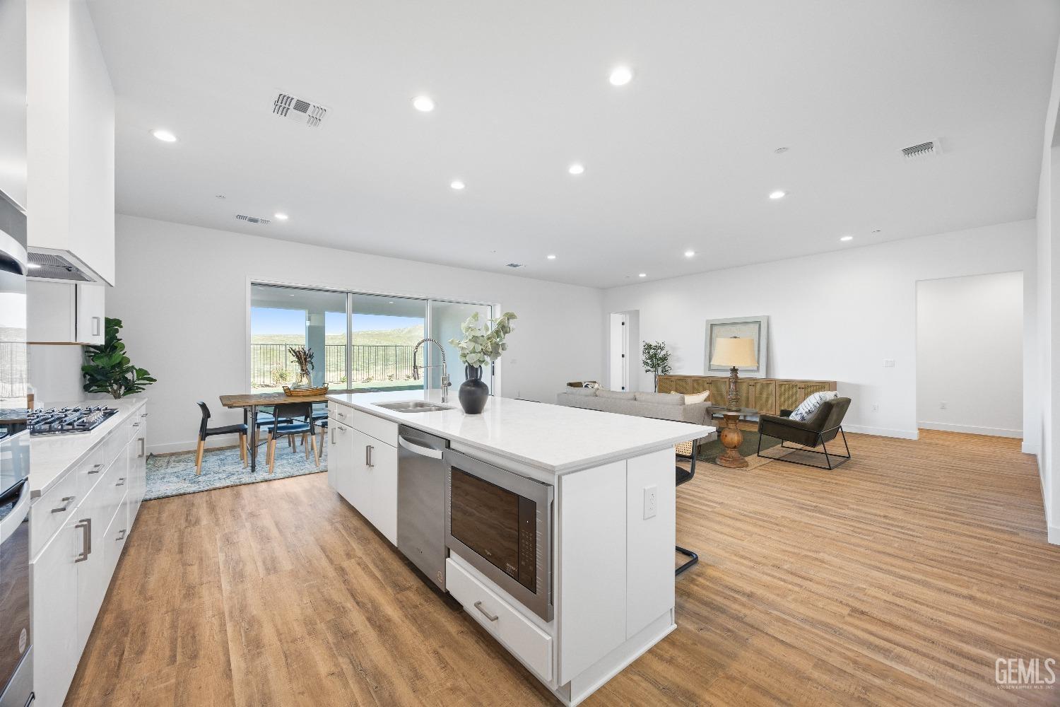 Undisclosed Address Bakersfield, CA 93314 - Photo 28 of 36 a kitchen with a sink a counter top space and stainless steel appliances