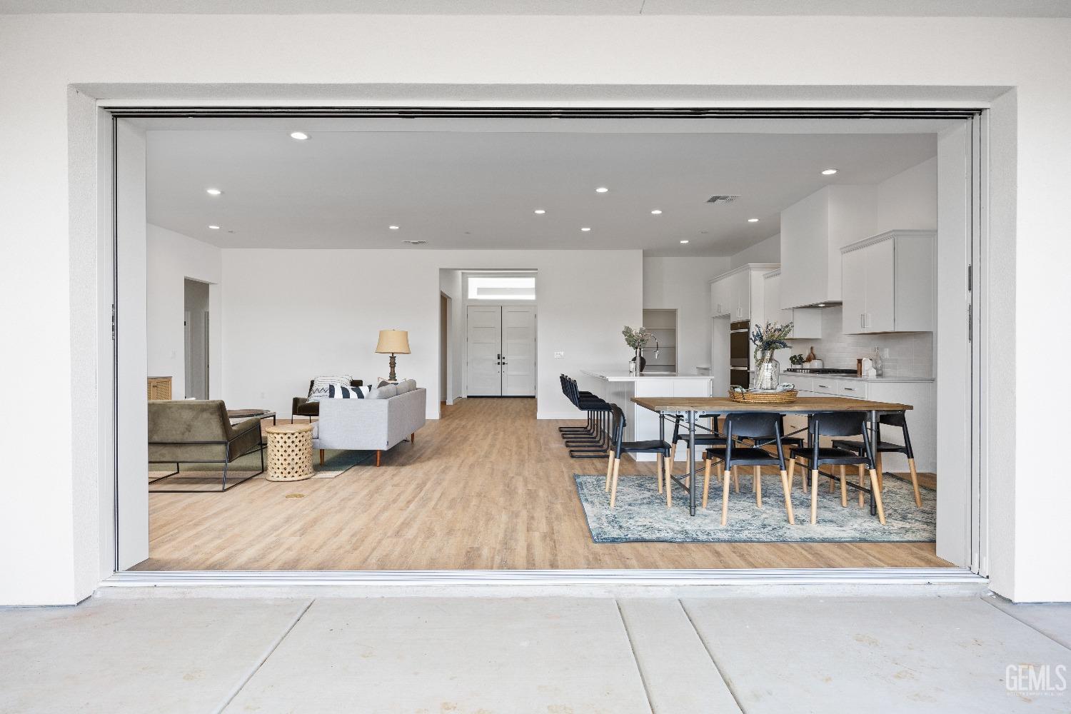 Undisclosed Address Bakersfield, CA 93314 - Photo 33 of 36 a living room with furniture and a table