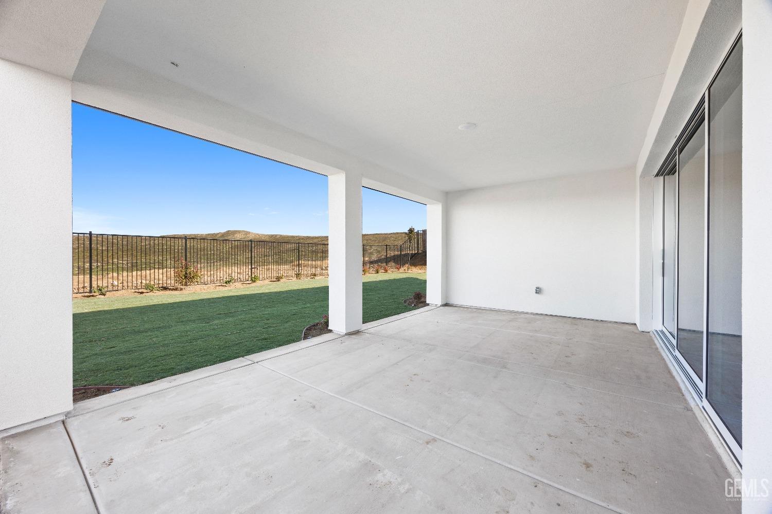 Undisclosed Address Bakersfield, CA 93314 - Photo 35 of 36 a view of an empty room with a floor to ceiling window and a yard
