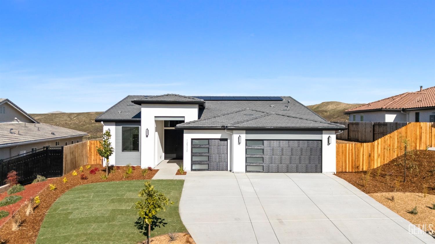 Undisclosed Address Bakersfield, CA 93314 - Photo 36 of 36 a front view of a house with a yard