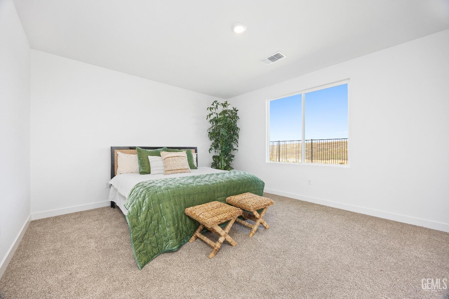 Undisclosed Address Bakersfield, CA 93314 - Photo 5 of 36 a bedroom with a bed and a window