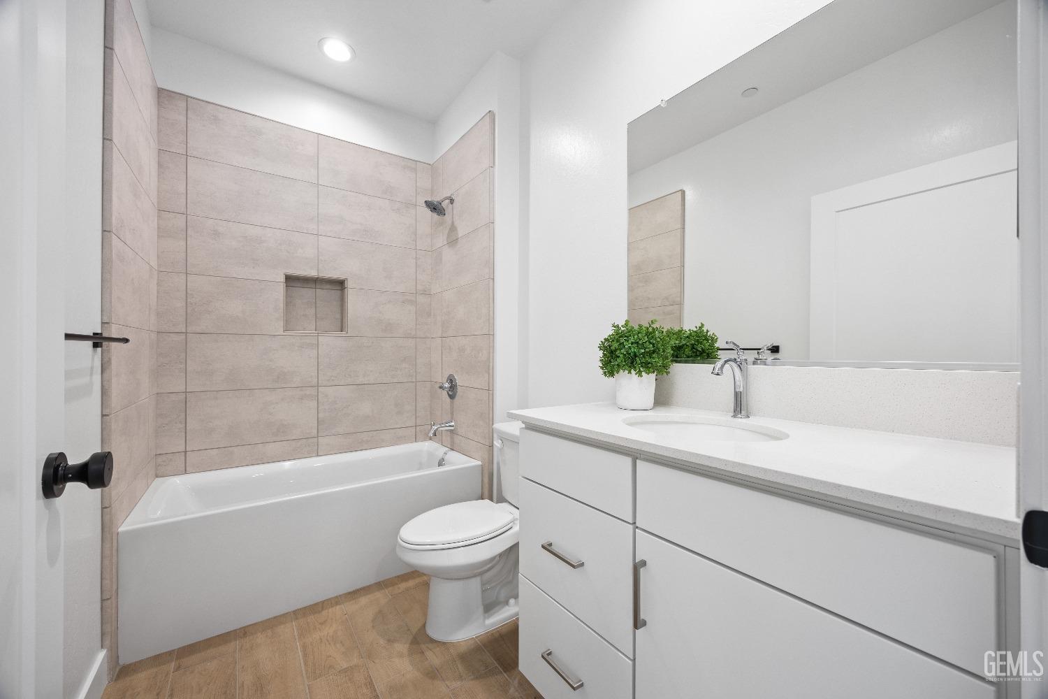 Undisclosed Address Bakersfield, CA 93314 - Photo 10 of 36 a bathroom with a sink a toilet and shower