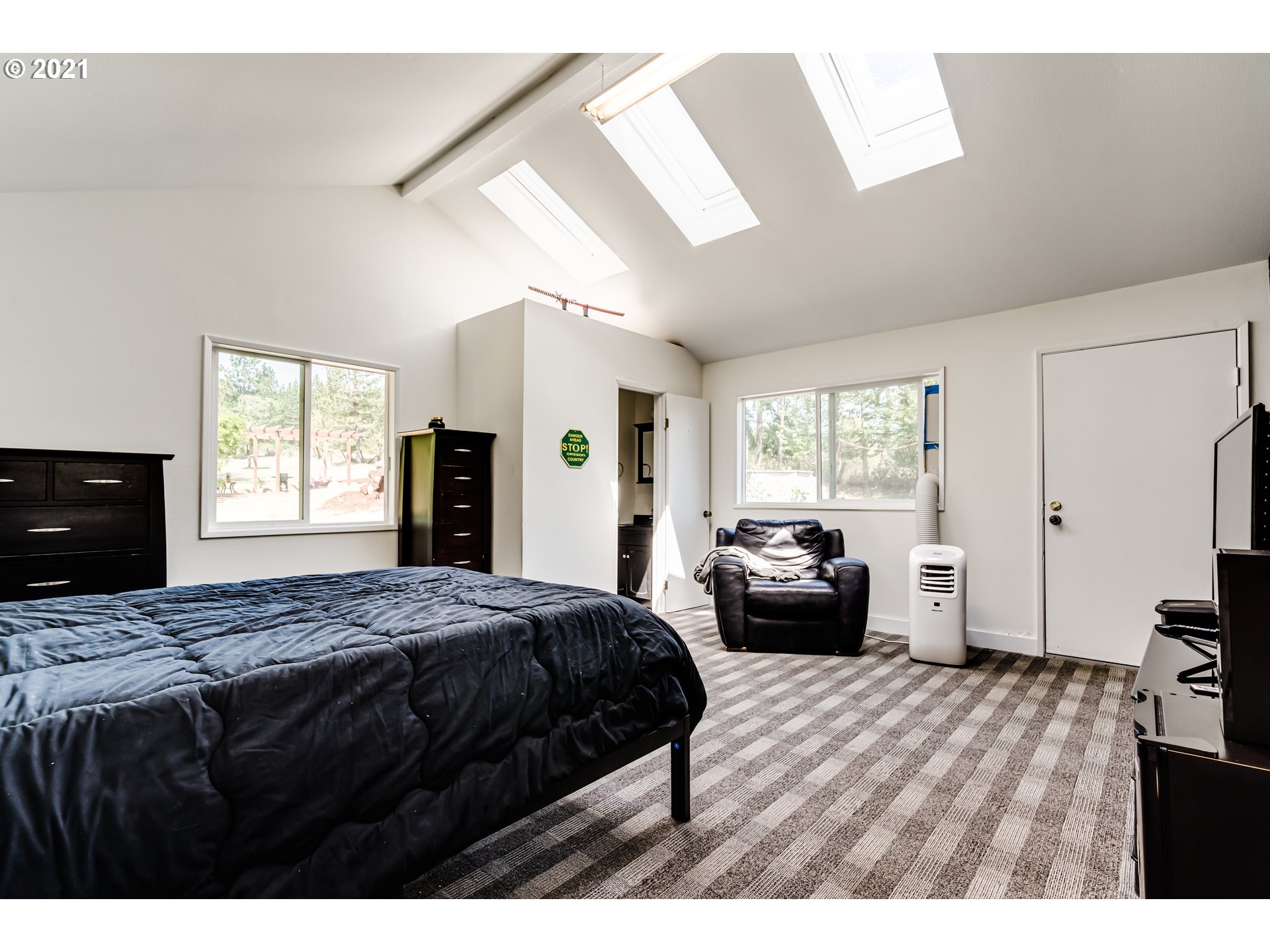 32945 Dillard Road Eugene, OR 97405 - Photo 27 of 30 a bedroom with a bed and a large window
