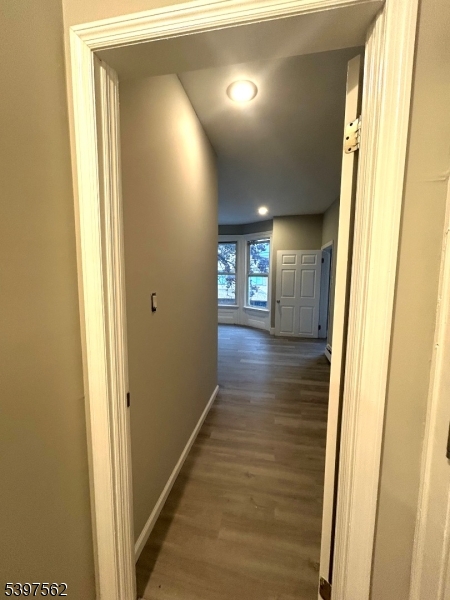 82 Pacific Street Newark, NJ 07105 - Photo 4 of 9 a view of hallway with wooden floor