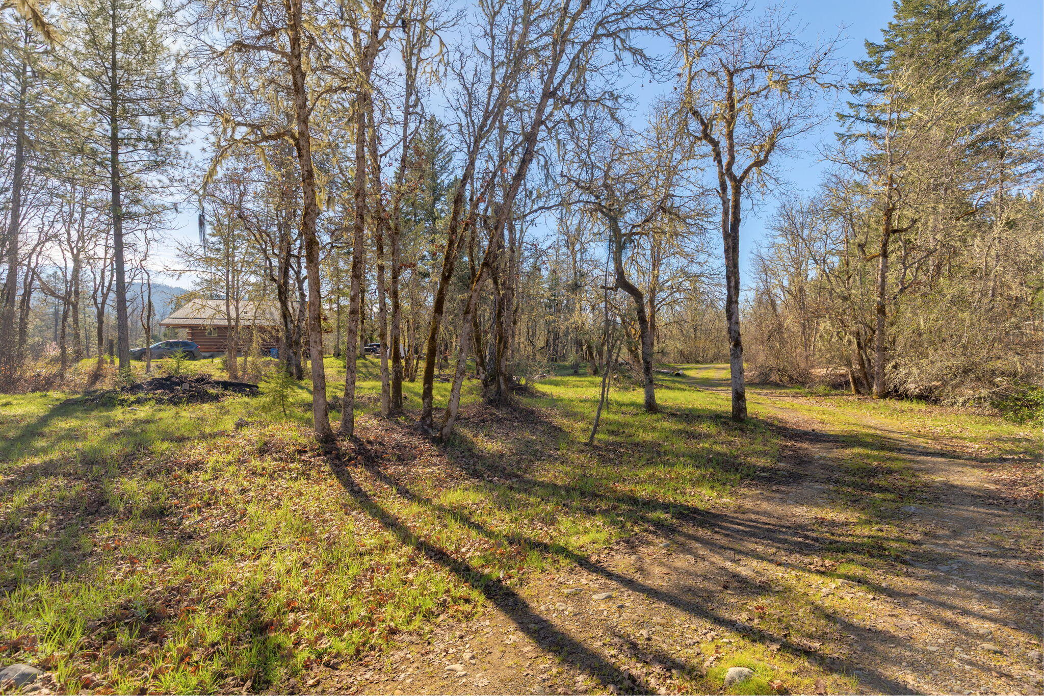 5737 Rockydale Road Cave Junction, OR 97523 - Photo 27 of 39 a view of a yard with basketball court