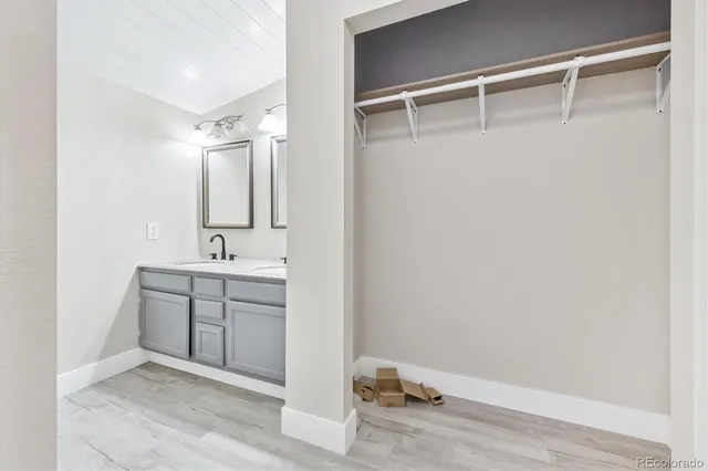 a bathroom with a sink and mirror