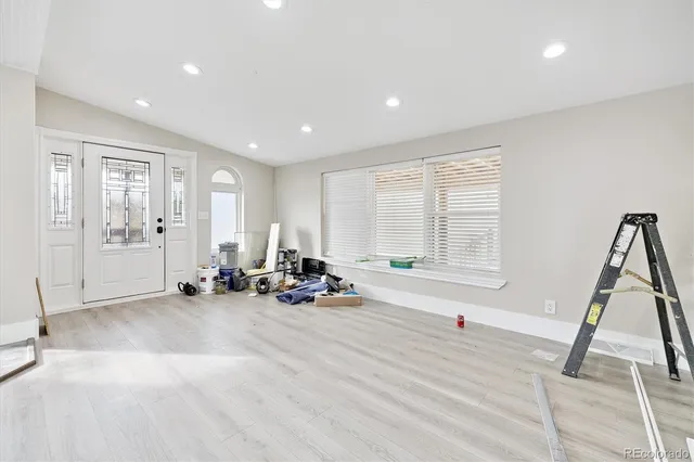 a view of a room with gym equipment and a window