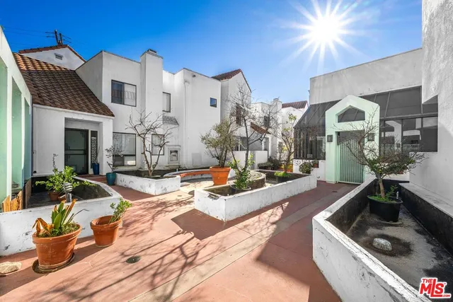 a living room with fireplace furniture and a chandelier