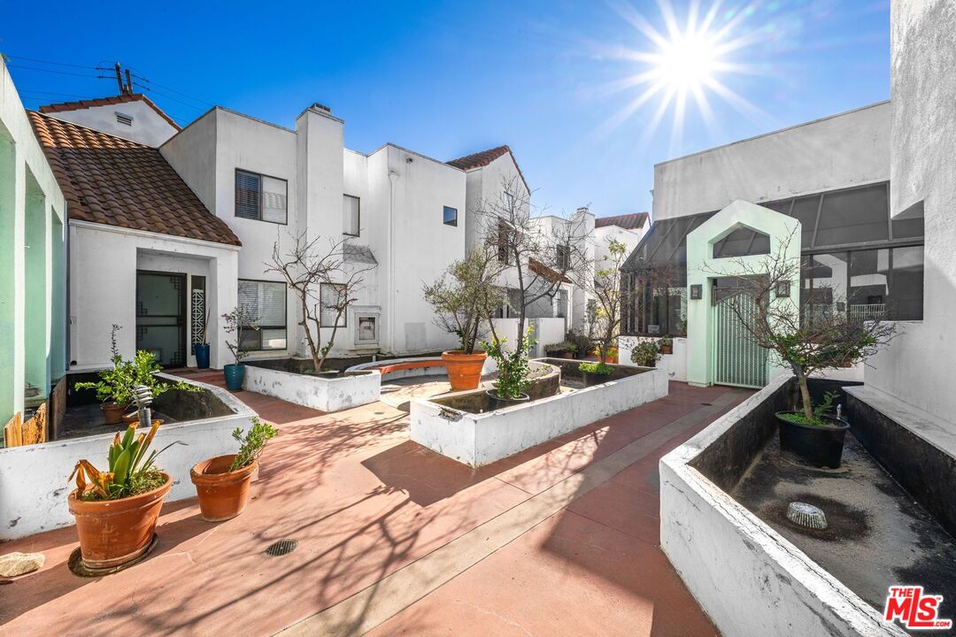 1340 Glenwood Road, Unit 4 Glendale, CA 91201 - Photo 1 of 12 a living room with fireplace furniture and a chandelier
