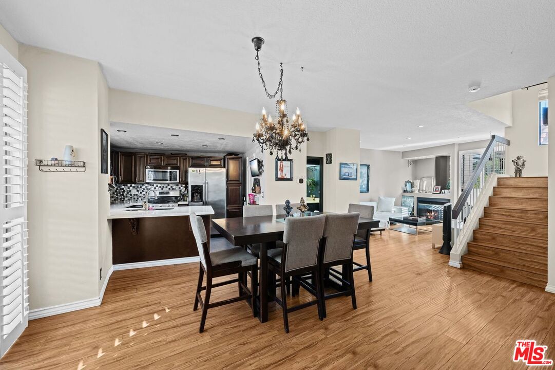 1340 Glenwood Road, Unit 4 Glendale, CA 91201 - Photo 2 of 12 a view of a dining room with furniture wooden floor and chandelier