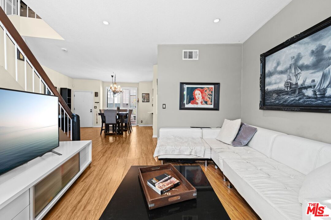 1340 Glenwood Road, Unit 4 Glendale, CA 91201 - Photo 6 of 12 a living room with furniture and a flat screen tv