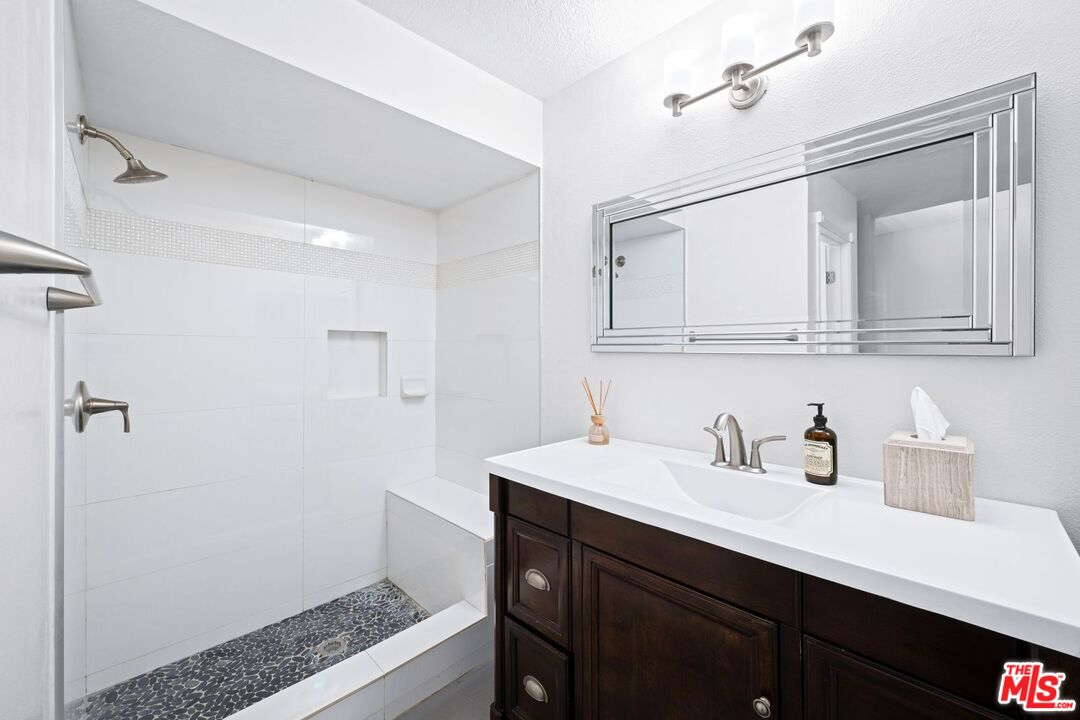 1340 Glenwood Road, Unit 4 Glendale, CA 91201 - Photo 7 of 12 a bathroom with a sink a vanity and a mirror