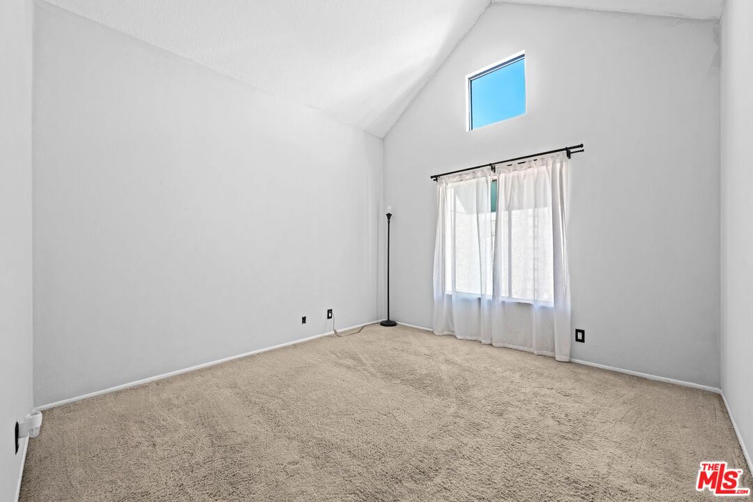 1340 Glenwood Road, Unit 4 Glendale, CA 91201 - Photo 9 of 12 a view of an empty room with a window