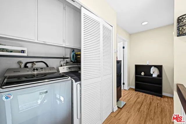 a kitchen with sink and cabinets