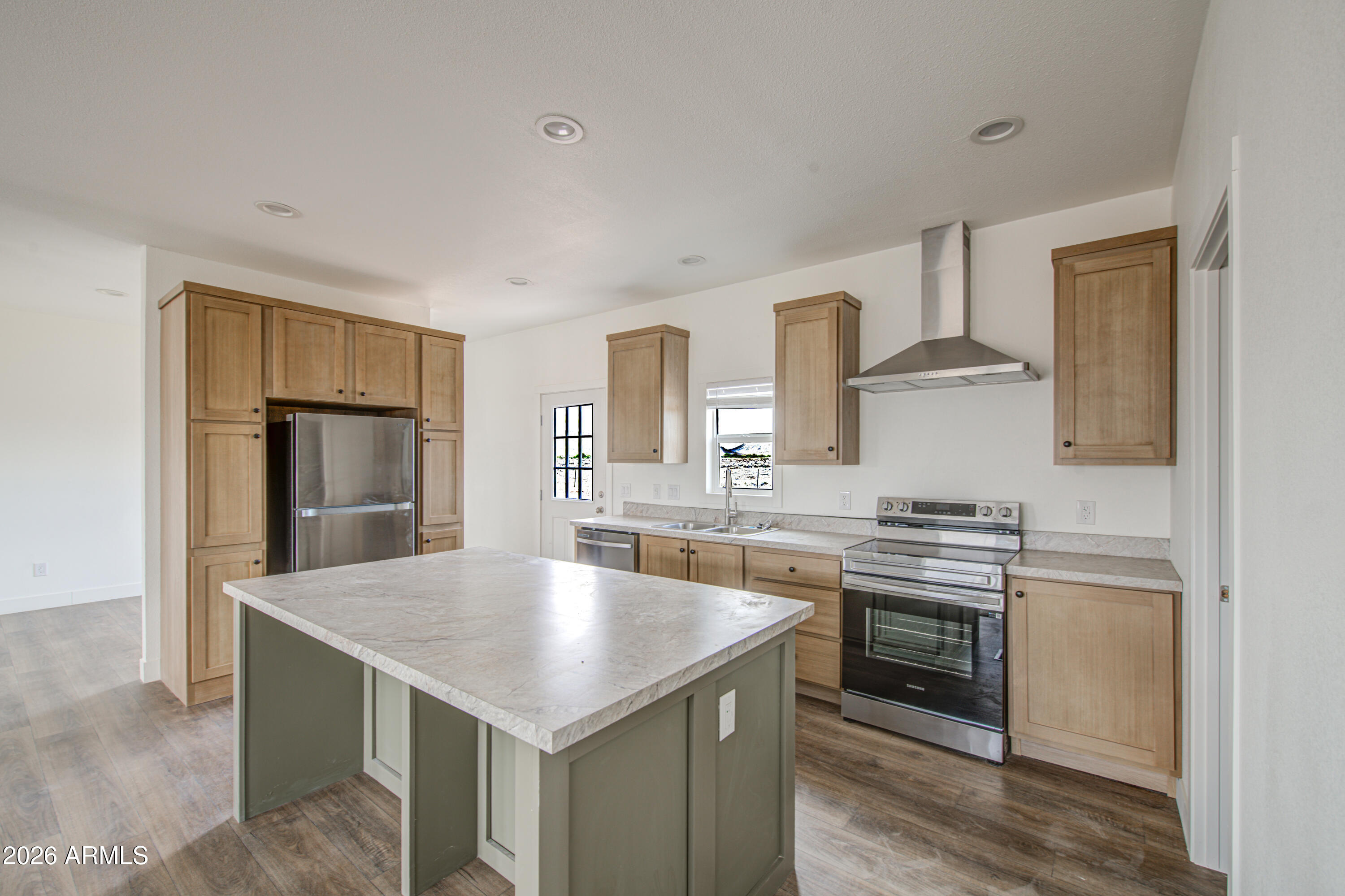 39120 West Maldonado Road Tonopah, AZ 85354 - Photo 12 of 37 a kitchen with a stove a sink and a refrigerator