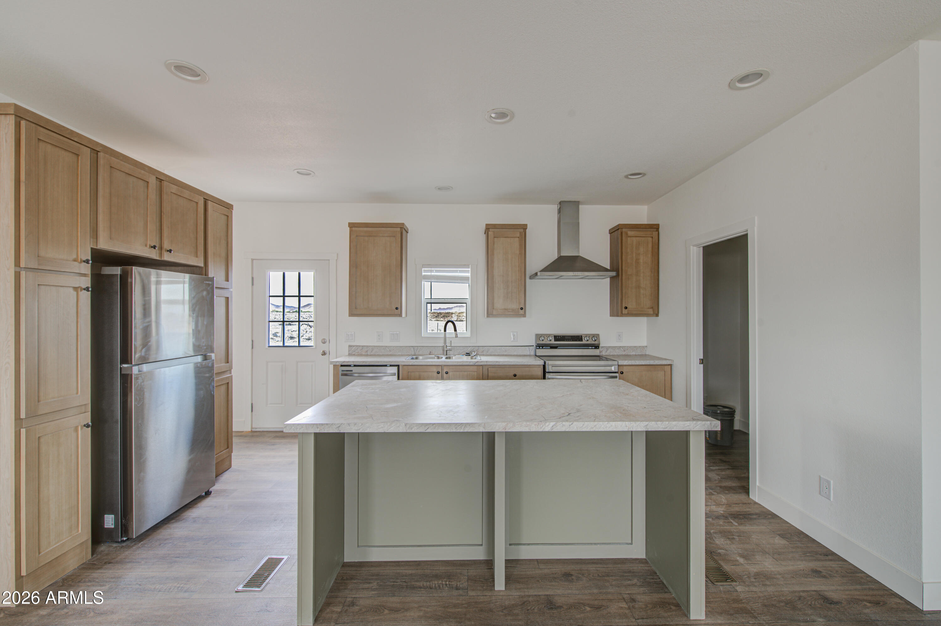 39120 West Maldonado Road Tonopah, AZ 85354 - Photo 13 of 37 a kitchen with kitchen island a sink stove and refrigerator