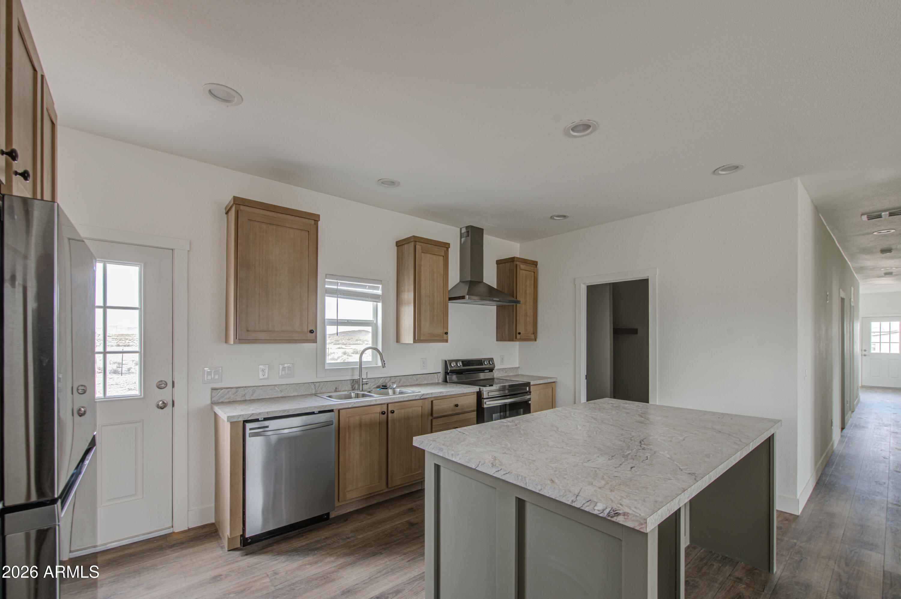 39120 West Maldonado Road Tonopah, AZ 85354 - Photo 14 of 37 a kitchen with a stove a sink and a refrigerator