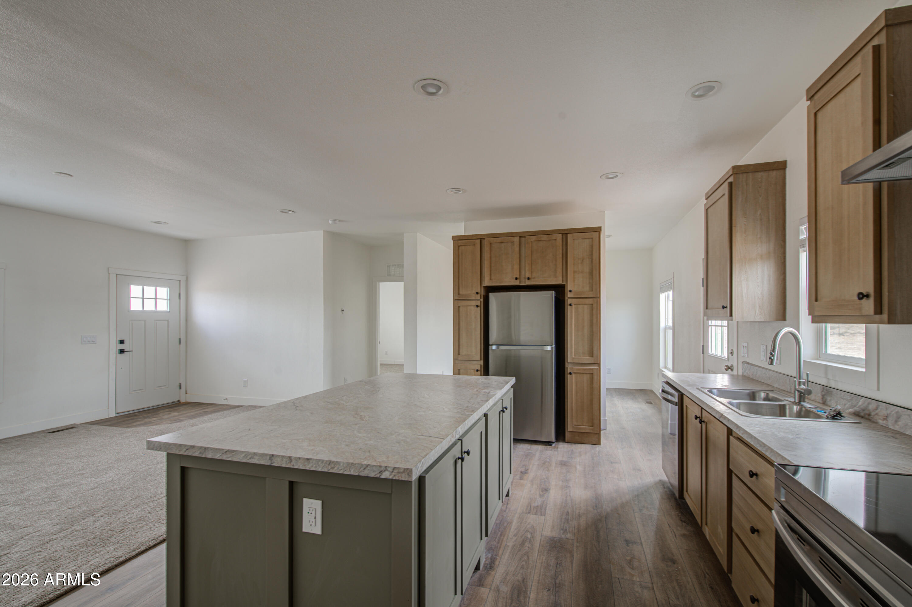 39120 West Maldonado Road Tonopah, AZ 85354 - Photo 15 of 37 a kitchen with a sink and refrigerator
