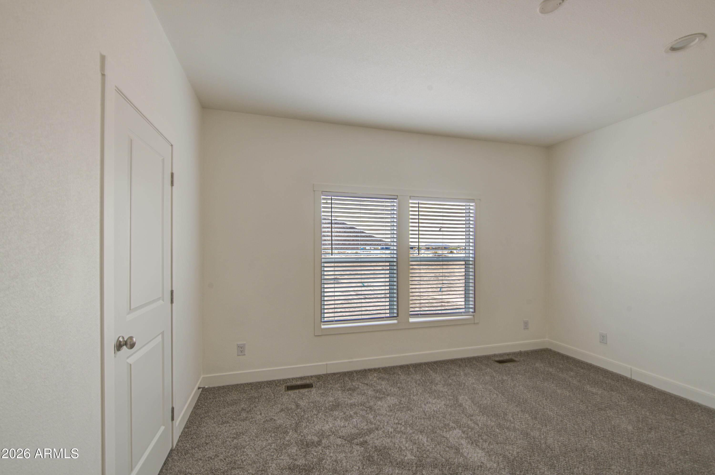 39120 West Maldonado Road Tonopah, AZ 85354 - Photo 21 of 37 an empty room with windows