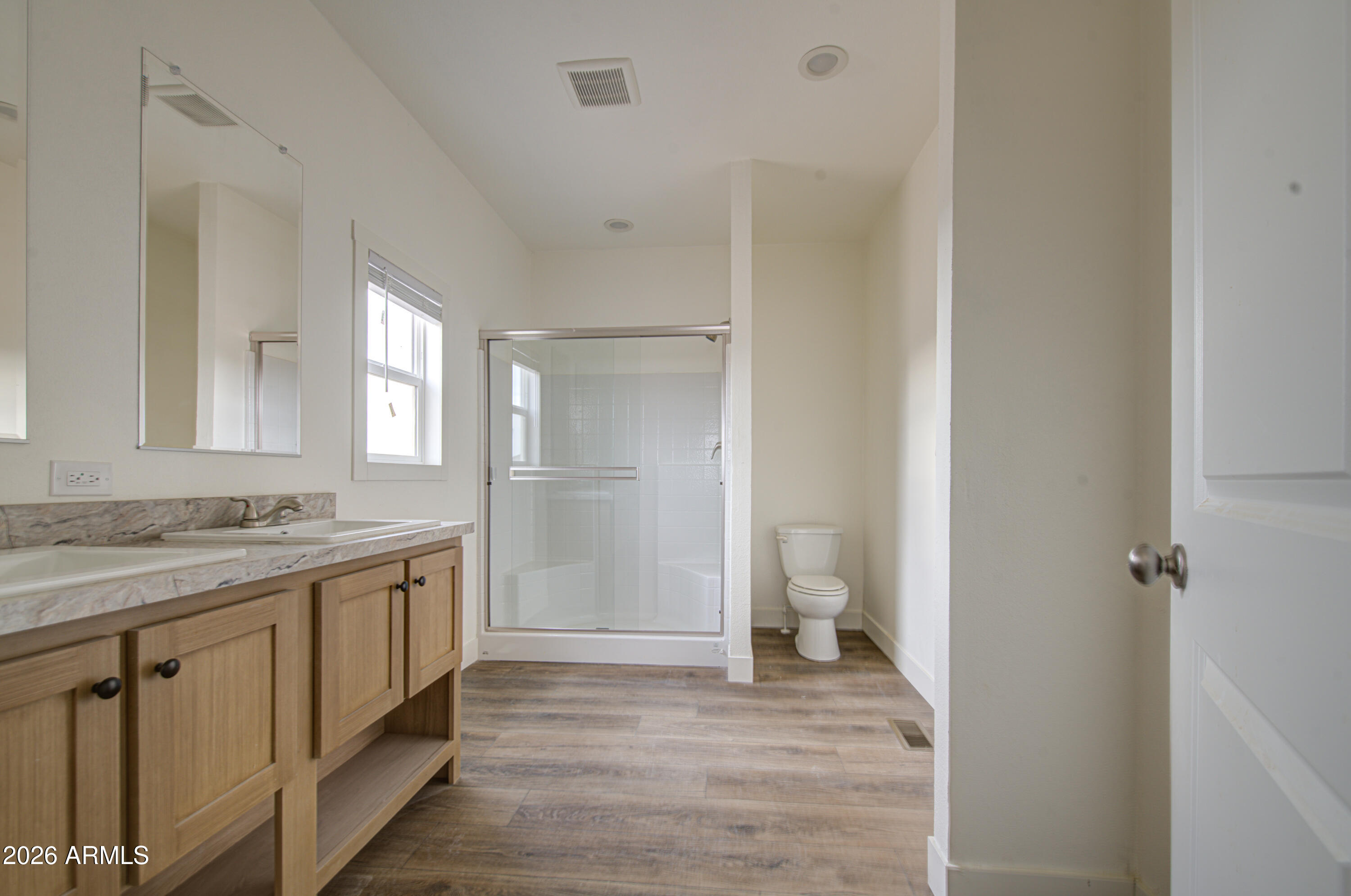 39120 West Maldonado Road Tonopah, AZ 85354 - Photo 24 of 37 a bathroom with a granite countertop sink and a mirror